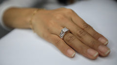 This micro pave stunning ring is displayed on a model's hand.